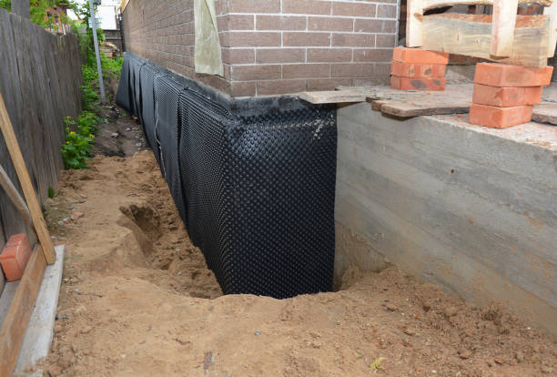 Happy homeowners after waterproofing job in Warrington